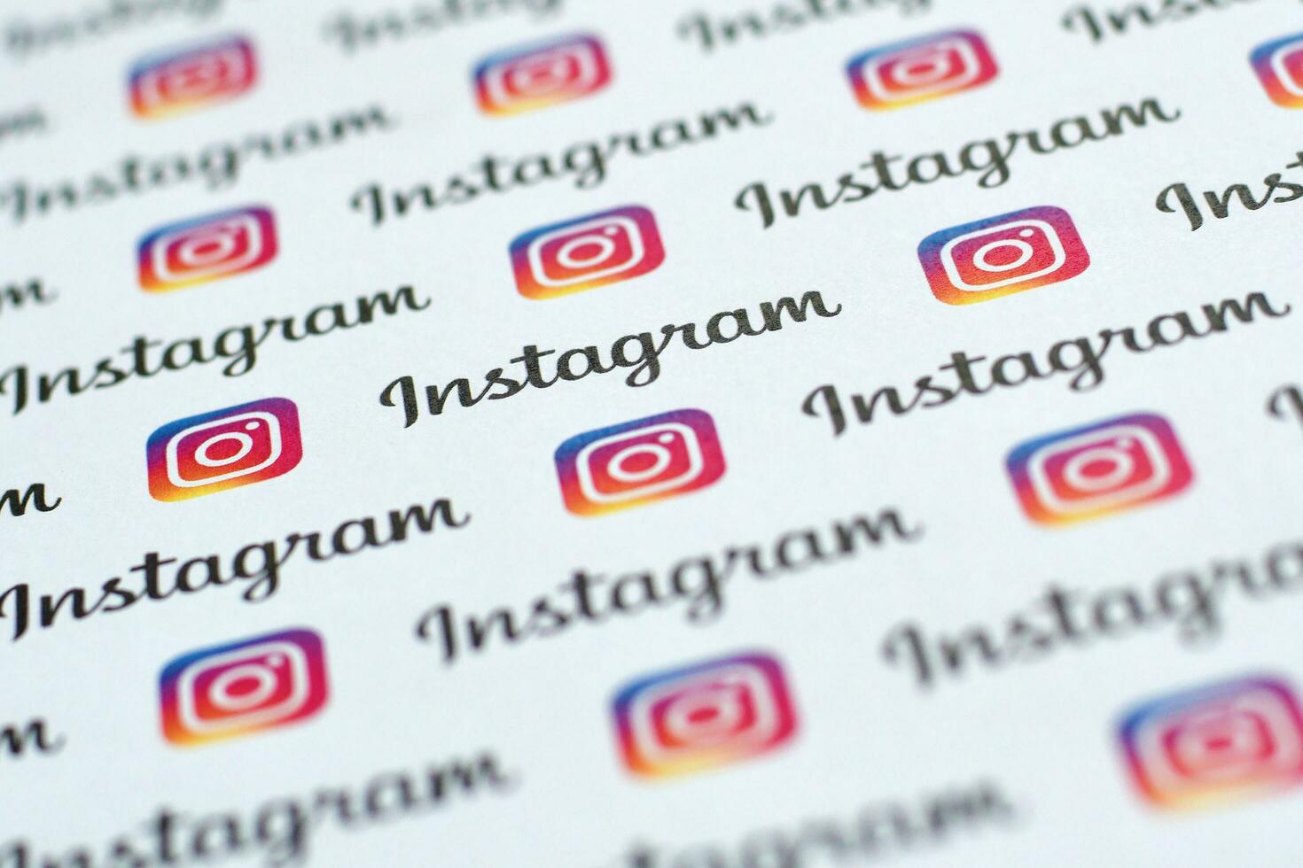 Instagram pattern printed on paper with small instagram logos and inscriptions. Instagram is American photo and video-sharing social networking service owned by Facebook