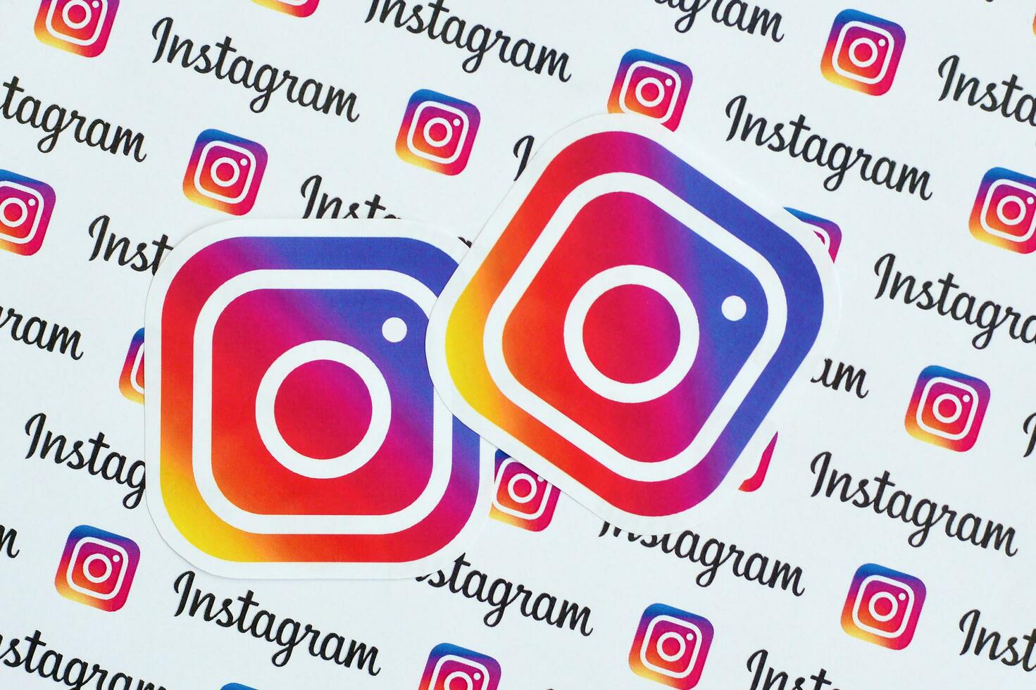 Instagram pattern printed on paper with small instagram logos and inscriptions. Instagram is American photo and video-sharing social networking service owned by Facebook