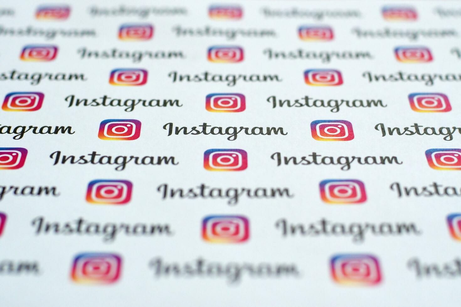 Instagram pattern printed on paper with small instagram logos and inscriptions. Instagram is American photo and video-sharing social networking service owned by Facebook
