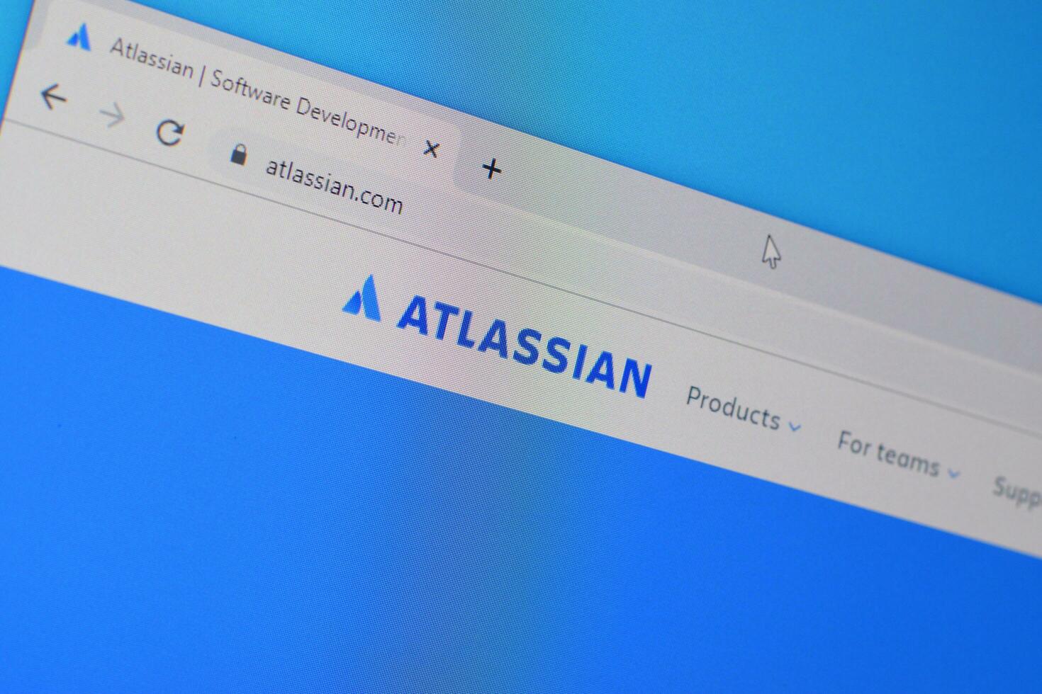 Homepage of atlassian website on the display of PC, url - atlassian.com. photo