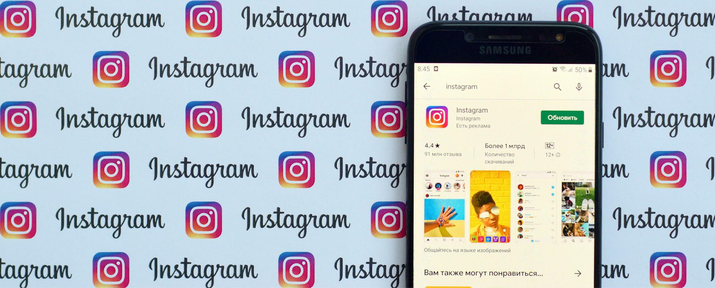 Instagram app on samsung smartphone screen on banner with small instagram logos. Instagram is American photo and video-sharing social networking service by Facebook inc