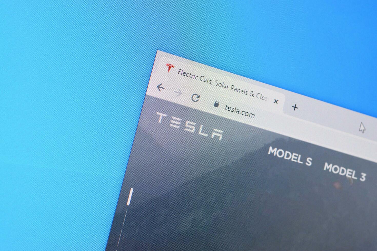 Homepage of tesla website on the display of PC, url - tesla.com. photo