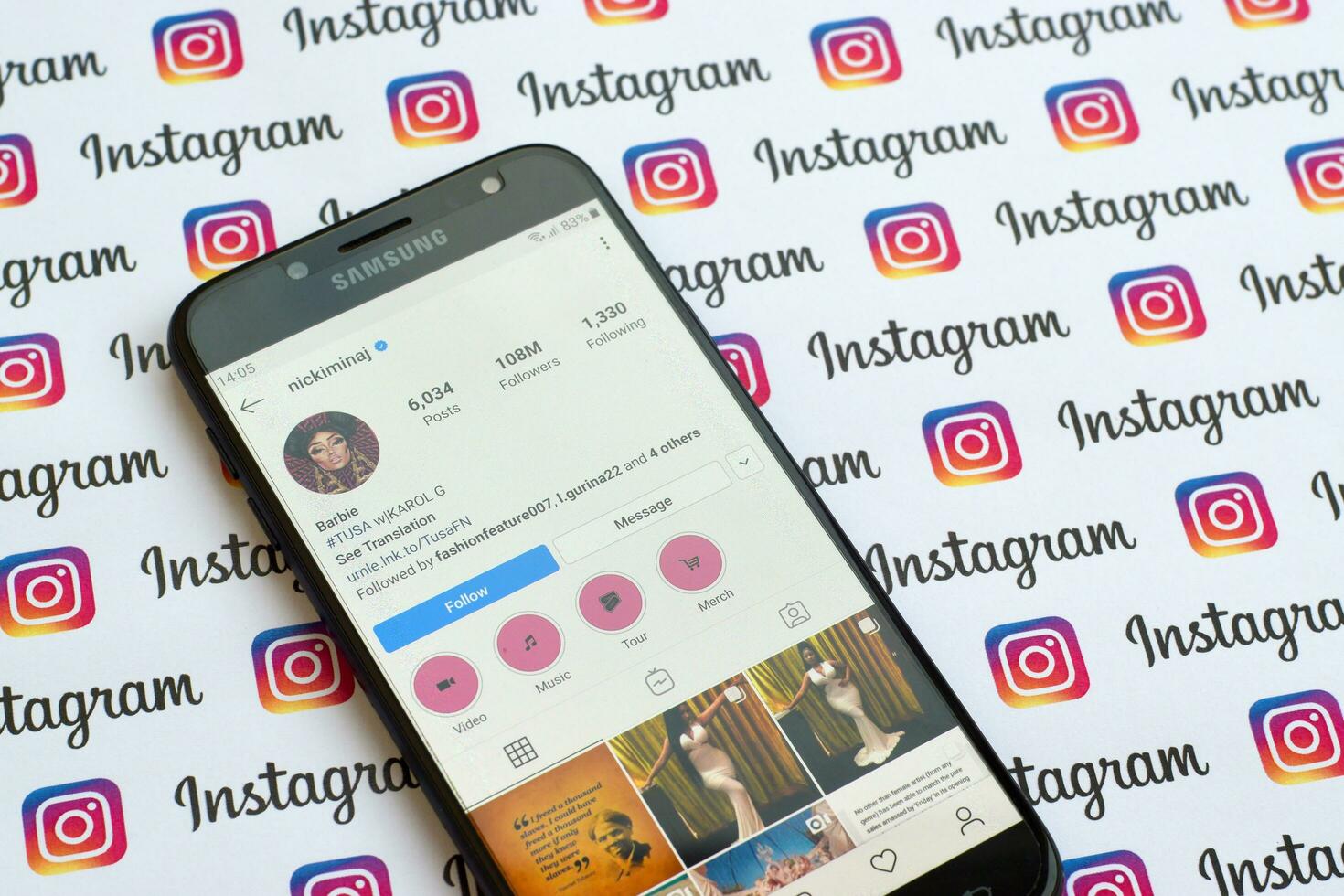 Nicki Minaj official instagram account on smartphone screen on paper instagram banner. photo