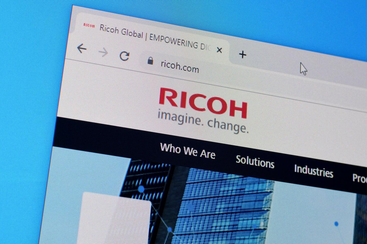 Homepage of ricoh website on the display of PC, url - ricoh.com. photo