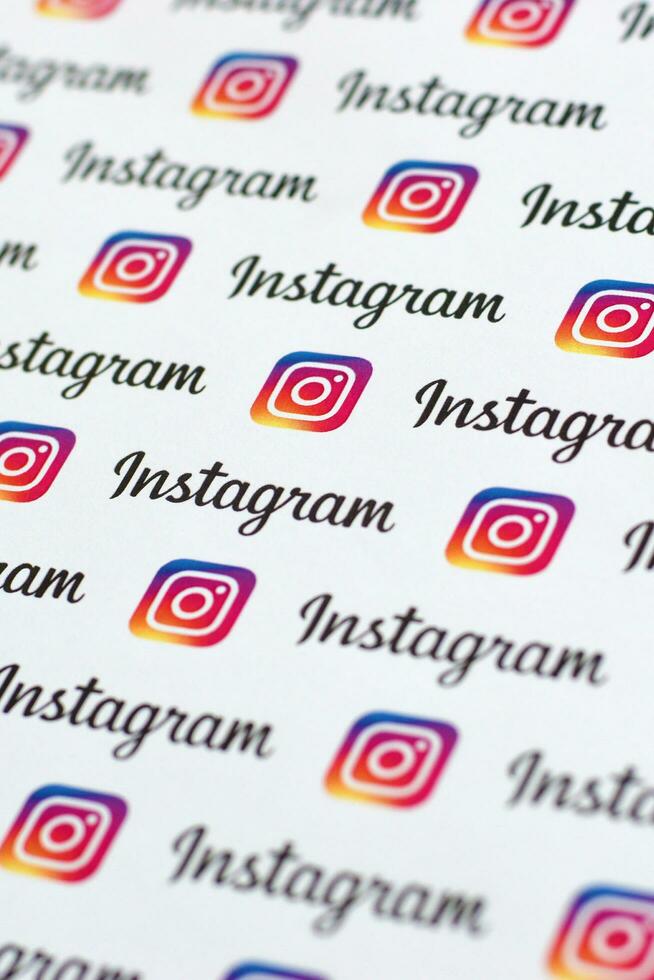 Instagram pattern printed on paper with small instagram logos and inscriptions. Instagram is American photo and video-sharing social networking service owned by Facebook