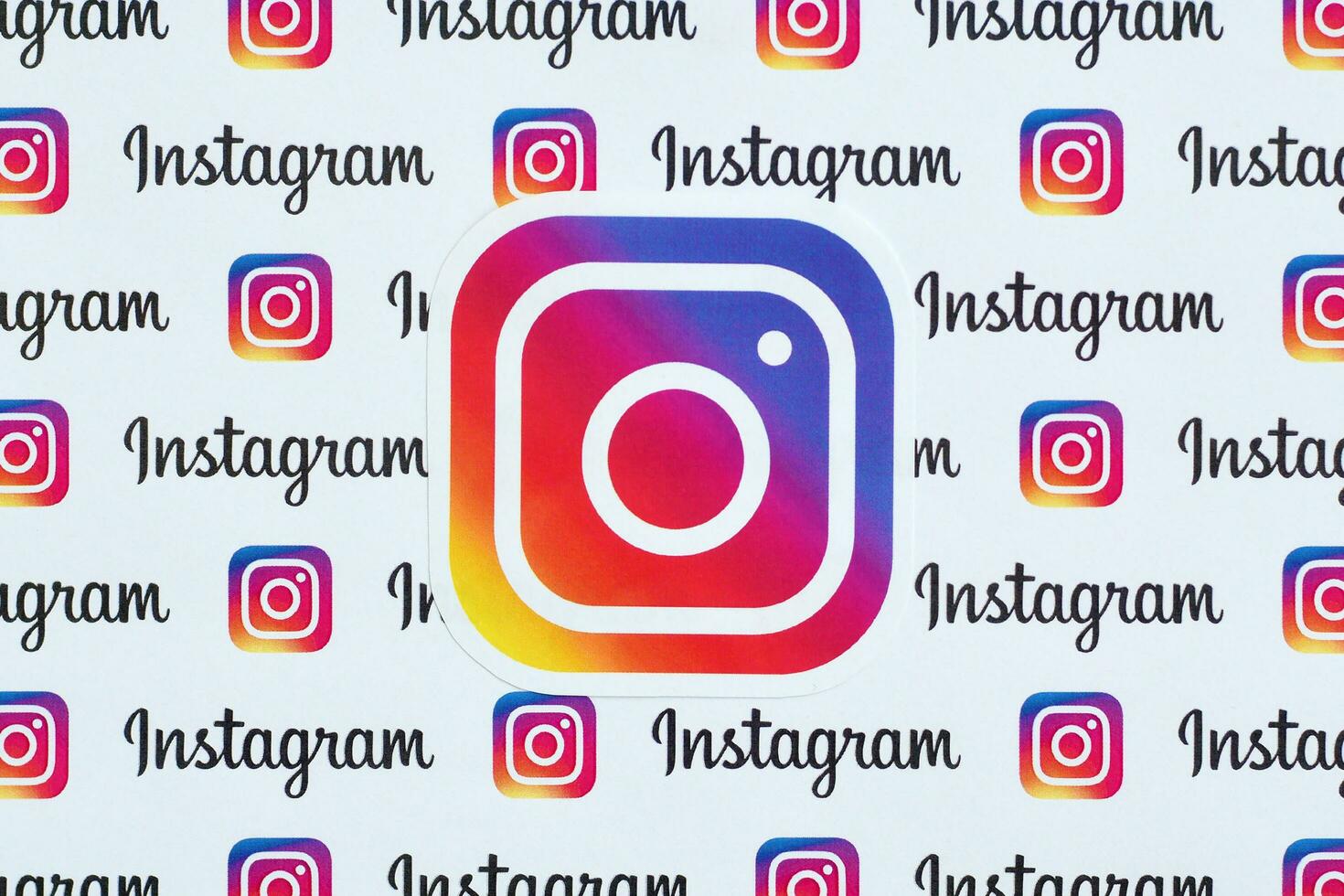 Instagram pattern printed on paper with small instagram logos and inscriptions. Instagram is American photo and video-sharing social networking service owned by Facebook