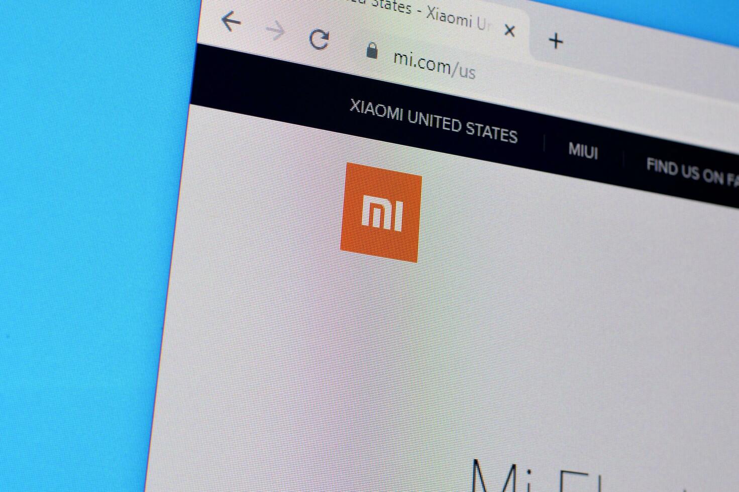 Homepage of xiaomi website on the display of PC, url - mi.com. photo