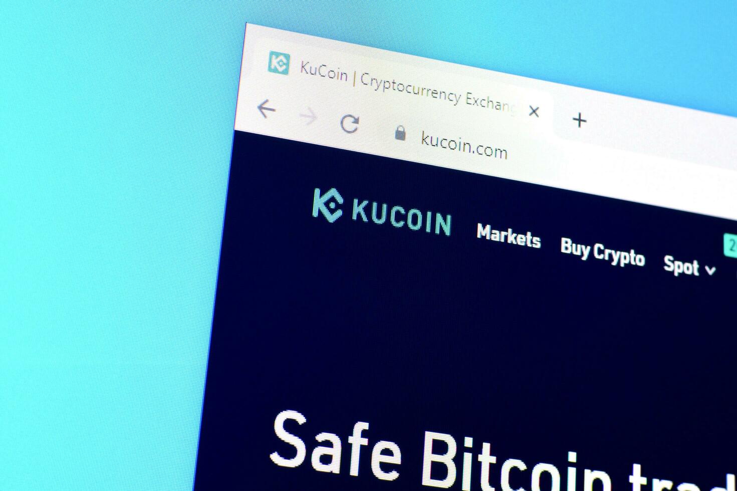Homepage of kucoin website on the display of PC, url - kucoin.com. photo