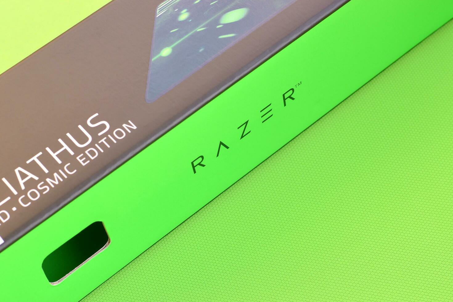 Razer Goliathus Speed Gaming green mouse pad and box with logo. Razer global gaming hardware manufacturing company, as well as an esports and financial services photo