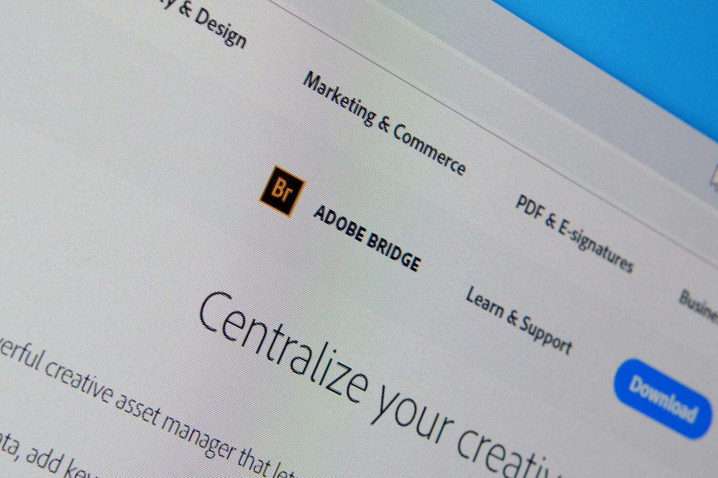 Web page of adobe bridge product on official website on the display of PC photo