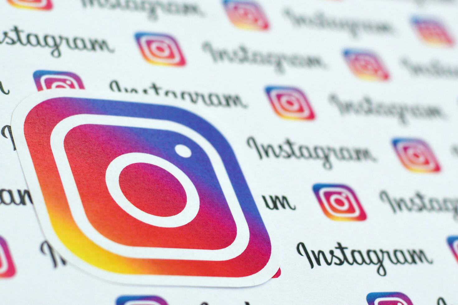 Instagram pattern printed on paper with small instagram logos and inscriptions. Instagram is American photo and video-sharing social networking service owned by Facebook