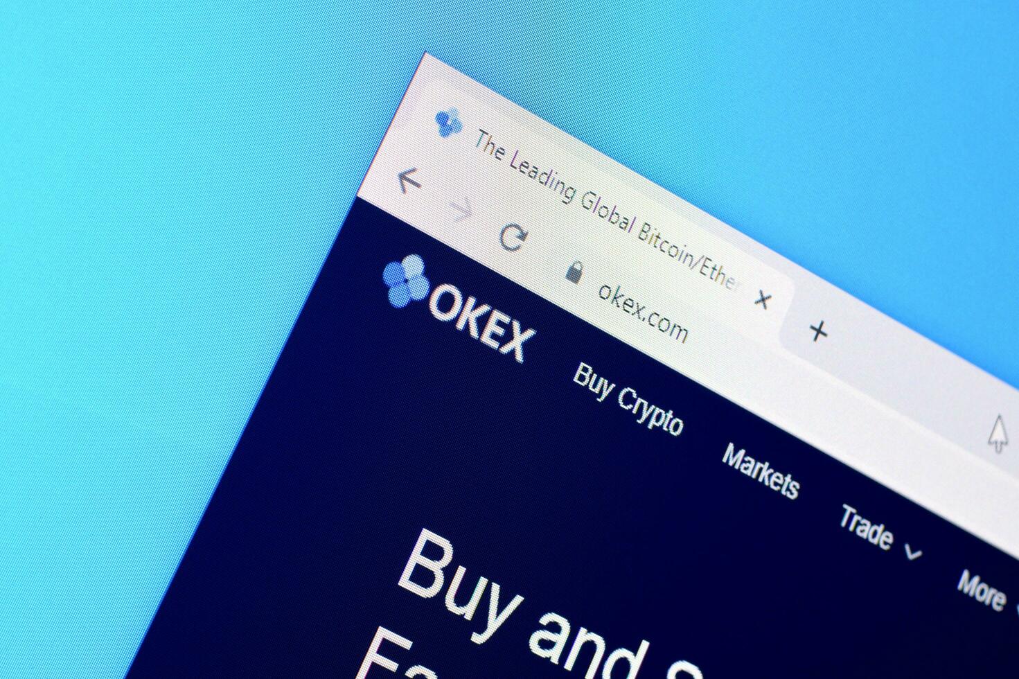 Homepage of okex website on the display of PC, url - okex.com. photo