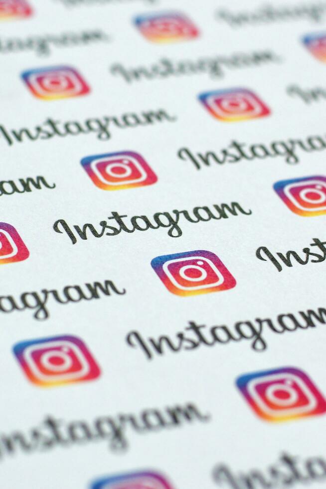 Instagram pattern printed on paper with small instagram logos and inscriptions. Instagram is American photo and video-sharing social networking service owned by Facebook