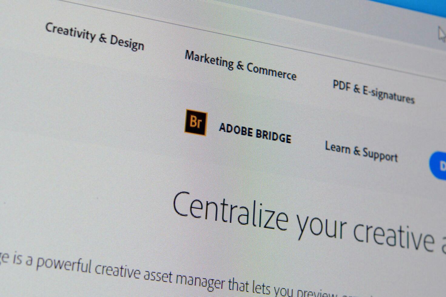 Web page of adobe bridge product on official website on the display of PC photo