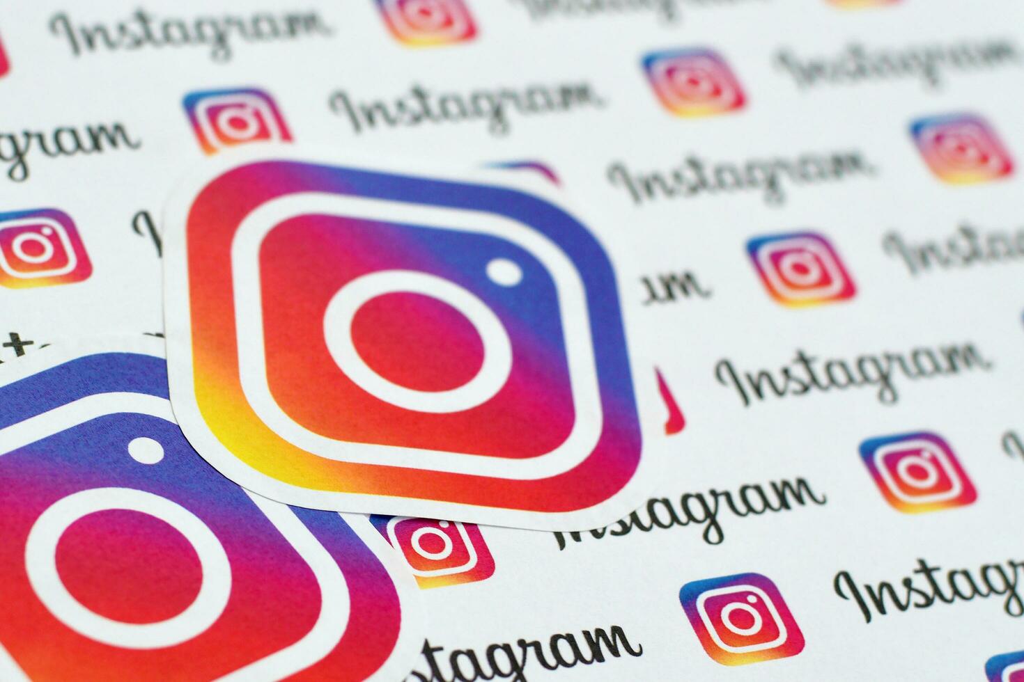 Instagram pattern printed on paper with small instagram logos and inscriptions. Instagram is American photo and video-sharing social networking service owned by Facebook