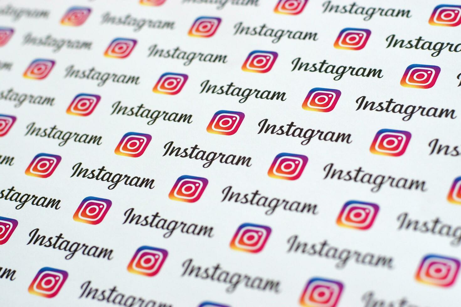 Instagram pattern printed on paper with small instagram logos and inscriptions. Instagram is American photo and video-sharing social networking service owned by Facebook
