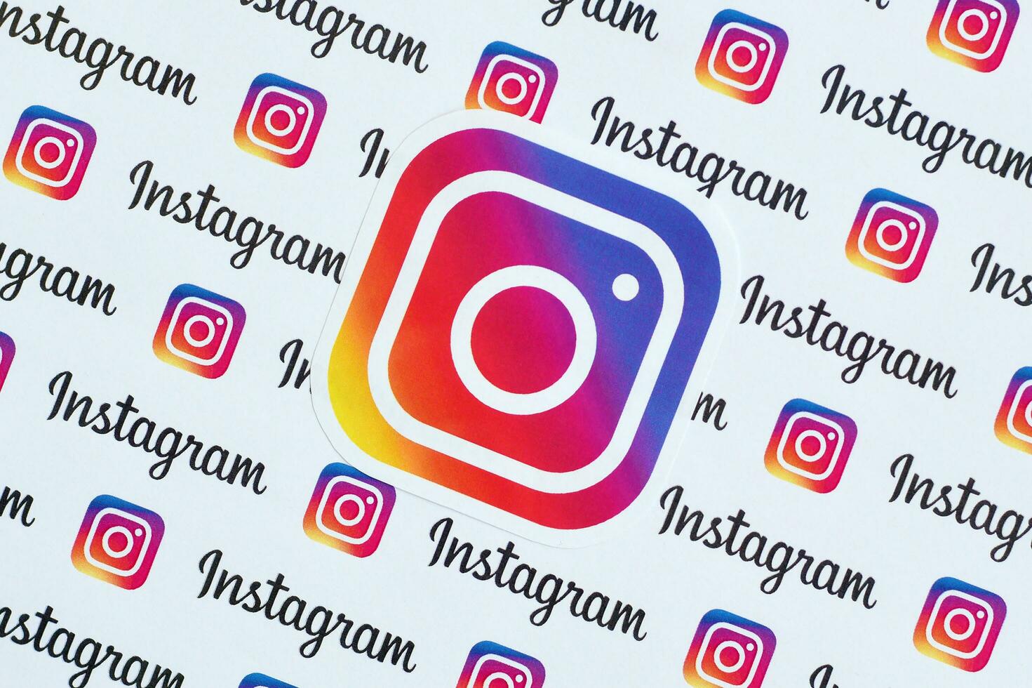 Instagram pattern printed on paper with small instagram logos and inscriptions. Instagram is American photo and video-sharing social networking service owned by Facebook