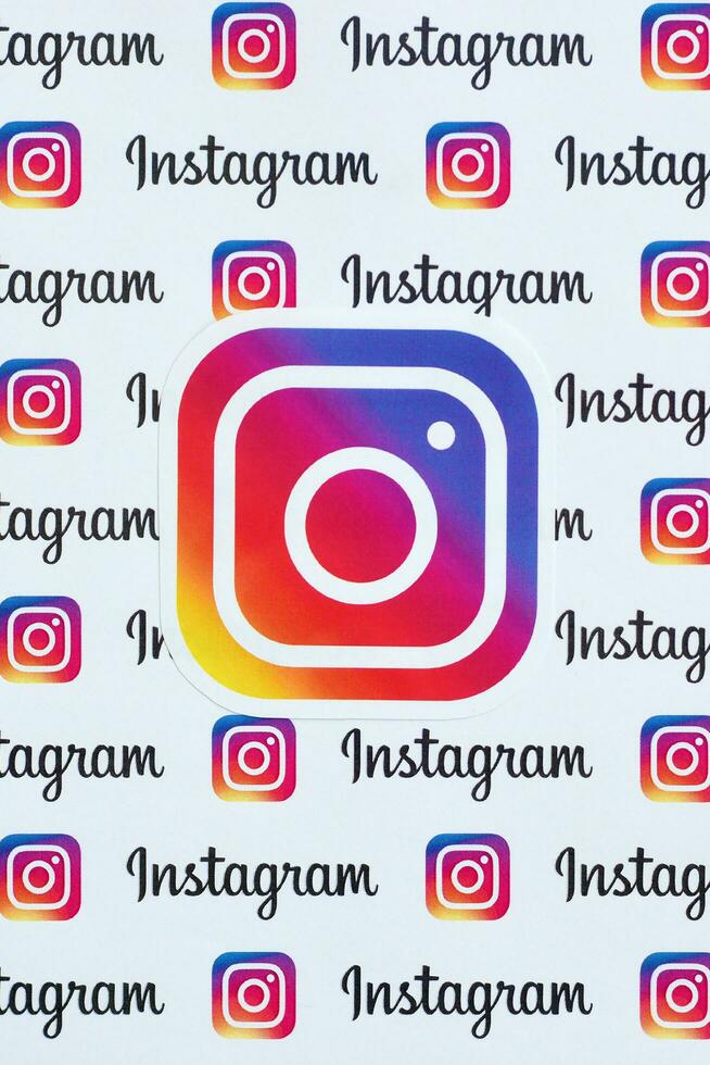 Instagram pattern printed on paper with small instagram logos and inscriptions. Instagram is American photo and video-sharing social networking service owned by Facebook