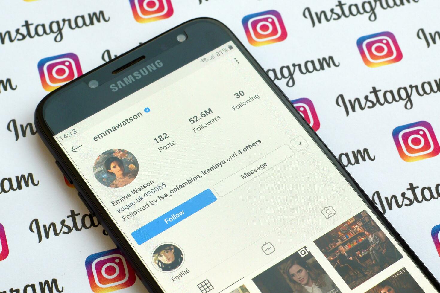 Emma Watson official instagram account on smartphone screen on paper instagram banner. photo
