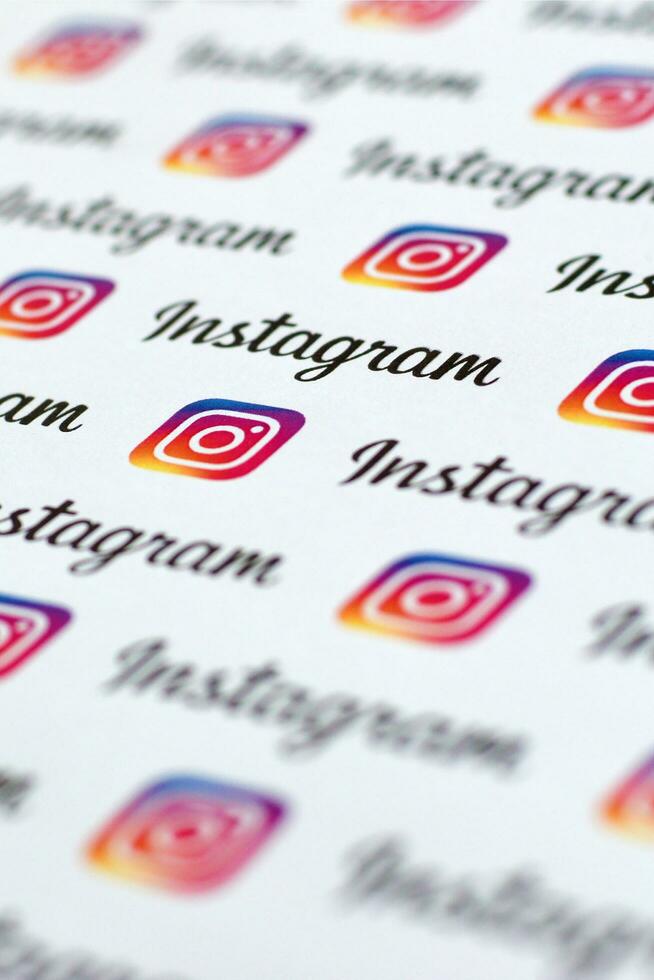 Instagram pattern printed on paper with small instagram logos and inscriptions. Instagram is American photo and video-sharing social networking service owned by Facebook