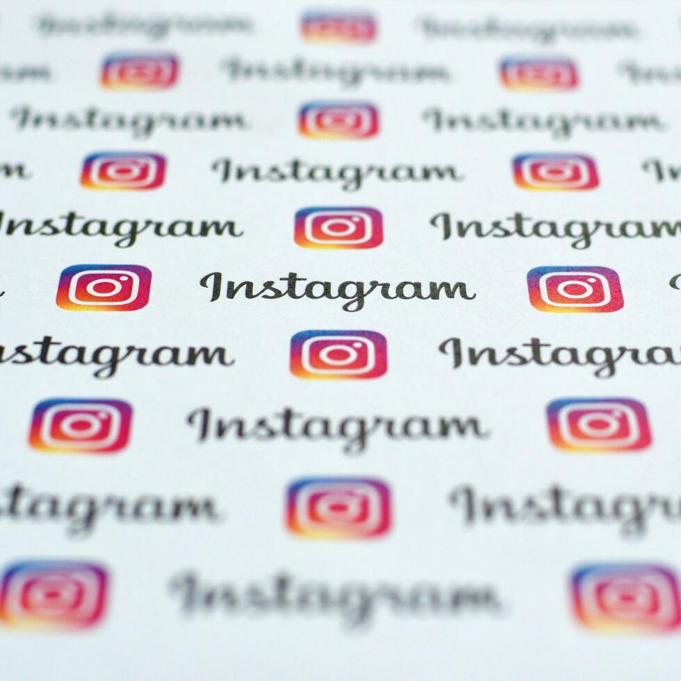 Instagram pattern printed on paper with small instagram logos and inscriptions. Instagram is American photo and video-sharing social networking service owned by Facebook