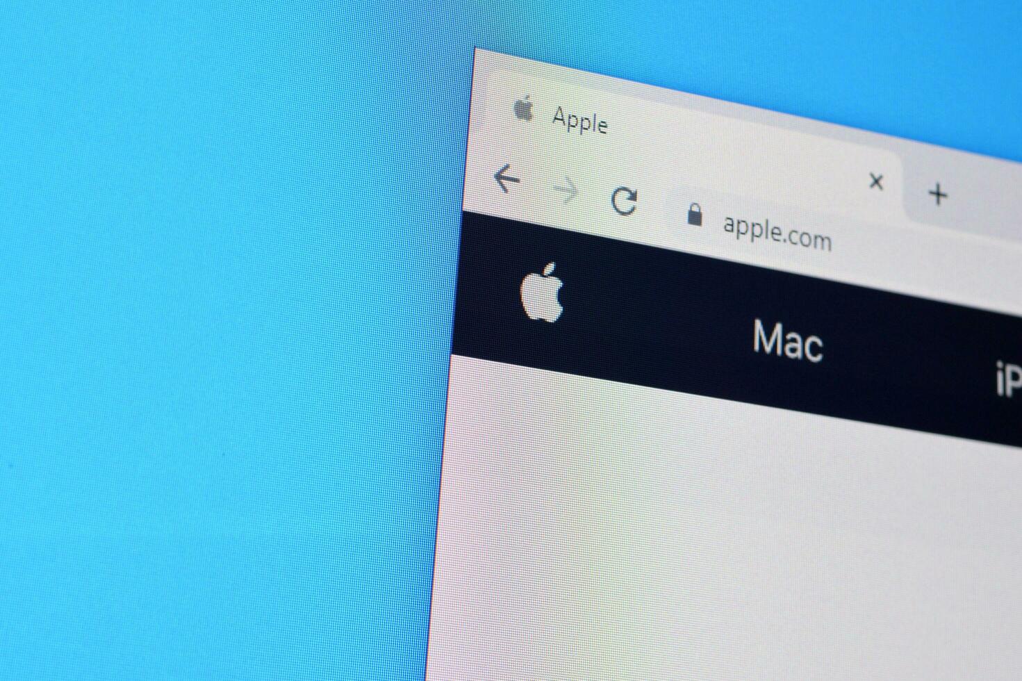Homepage of apple website on the display of PC, url - apple.com. photo