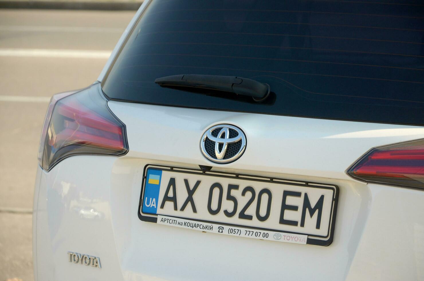 KHARKOV, UKRAINE - OCTOBER 21, 2019 Toyota logo on cars back part. Toyota Motor Corporation is Japanese automotive manufacturer photo