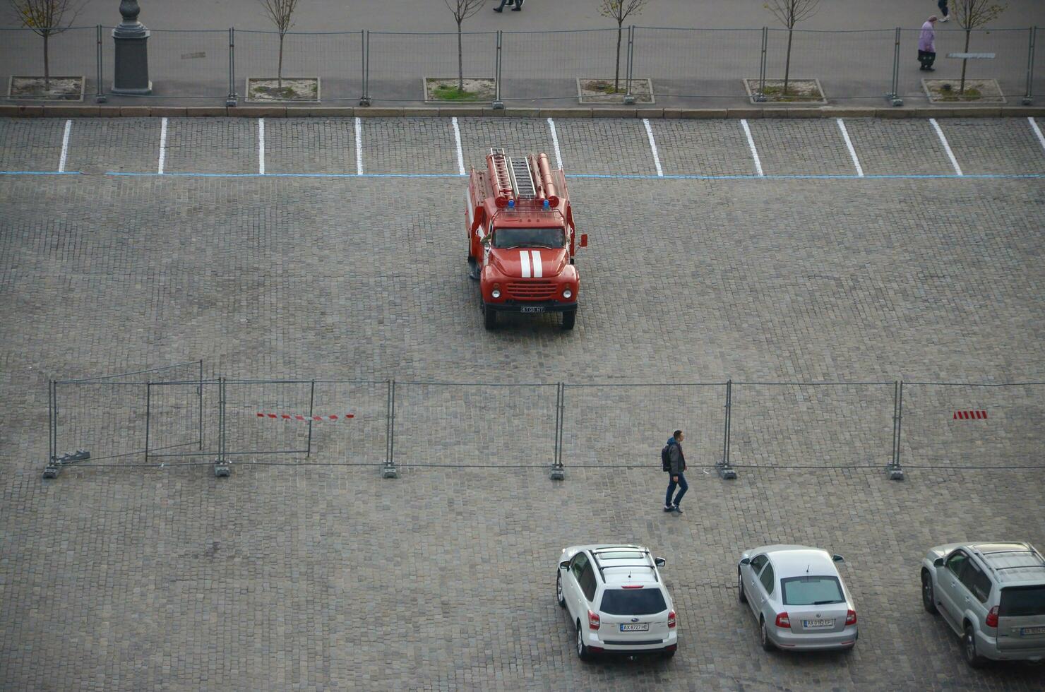 KHARKOV, UKRAINE - OCTOBER 25, 2019 Fire rescue truck from post soviet era parks on main Kharkiv city freedom square photo