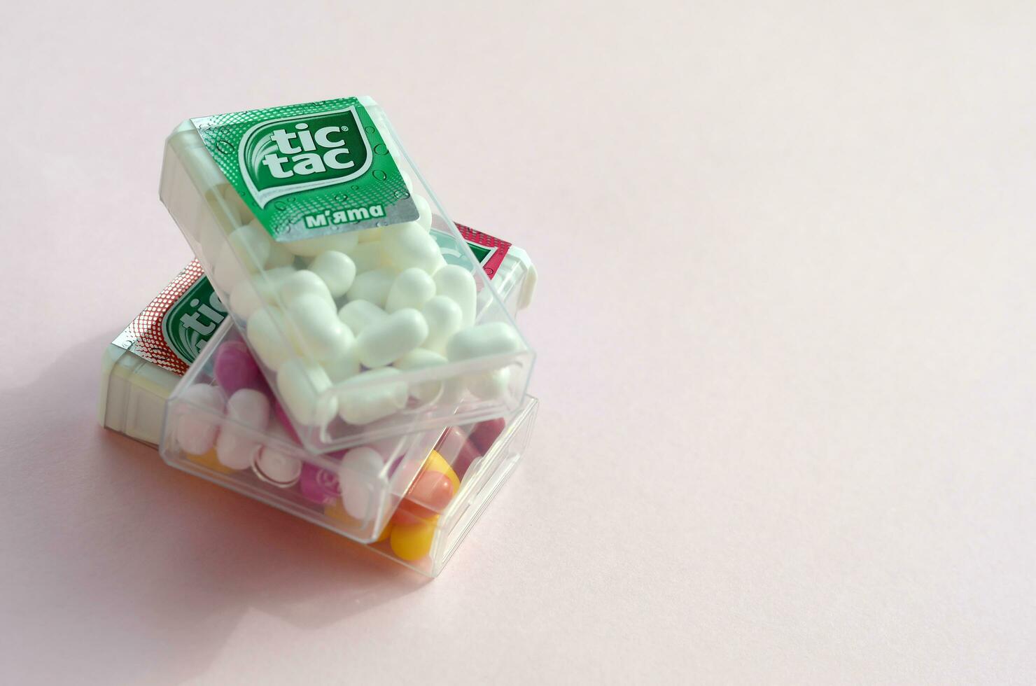 Many Tic Tac Candy packages close up. Tic tac is popular due its minty fresh taste and easy to carry. Hard mints produced by Ferrero since 1968 photo