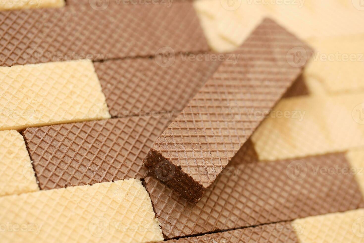 Stacked delicious chocolate wafers in large amount. Two different flavours of classic waffles photo