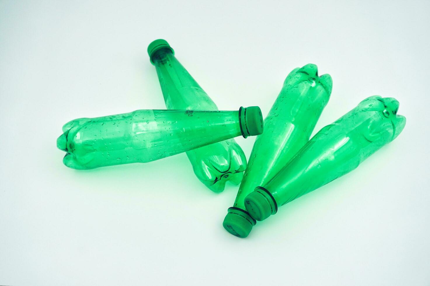 Green PET plastic bottle in white background photo