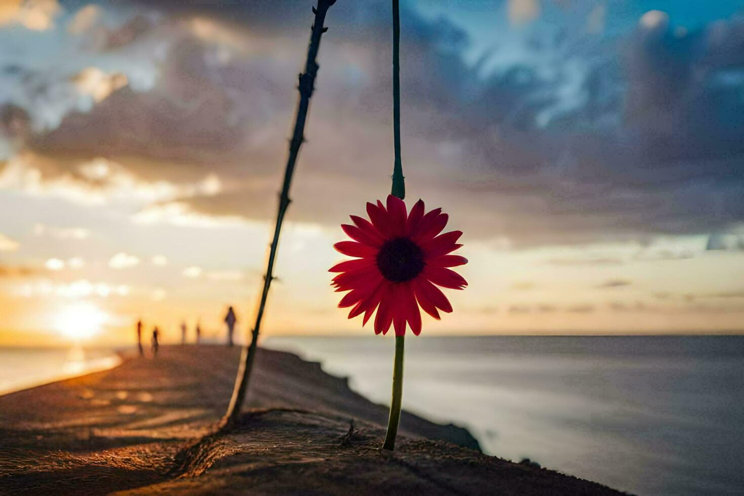 a red flower is hanging from a pole in front of the ocean. AI-Generated photo