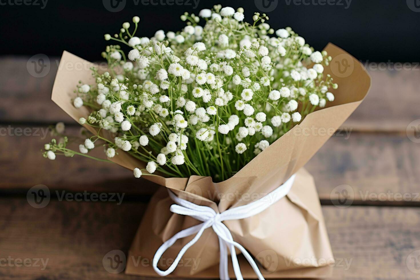 un ramo de flores de Gypsophila flores en un arte paquete en el mesa. ai generado foto