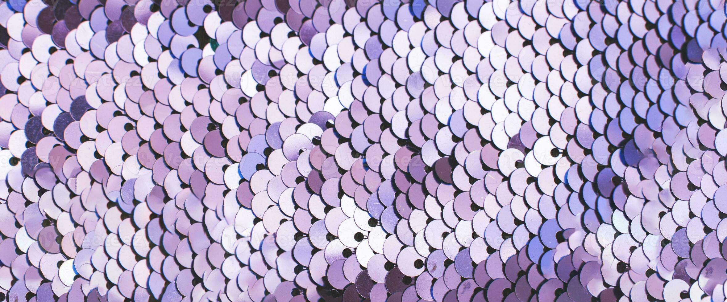 Purple abstract sequins sparkling background. Texture of sequins. photo