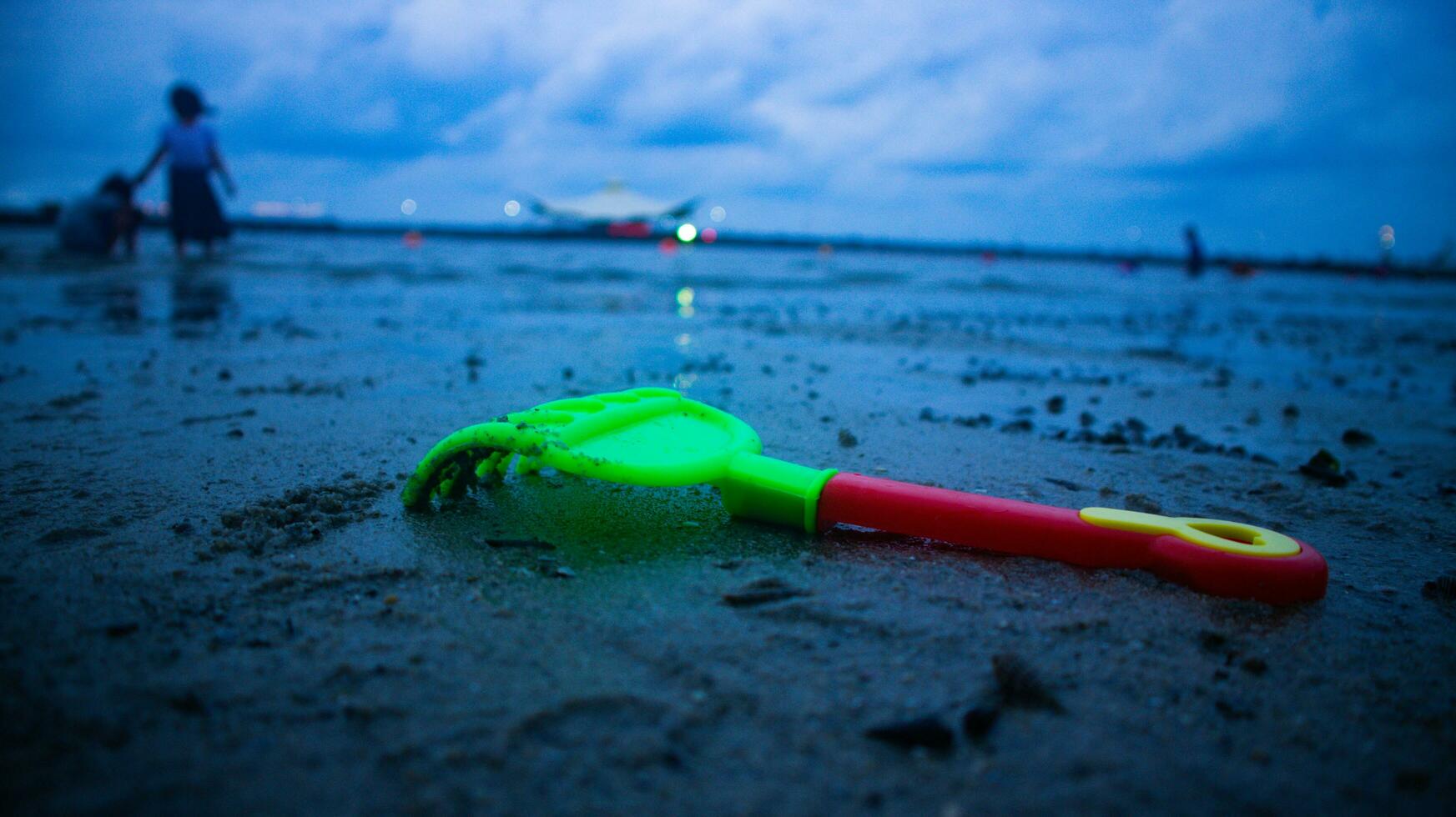 shovel left on the beach photo