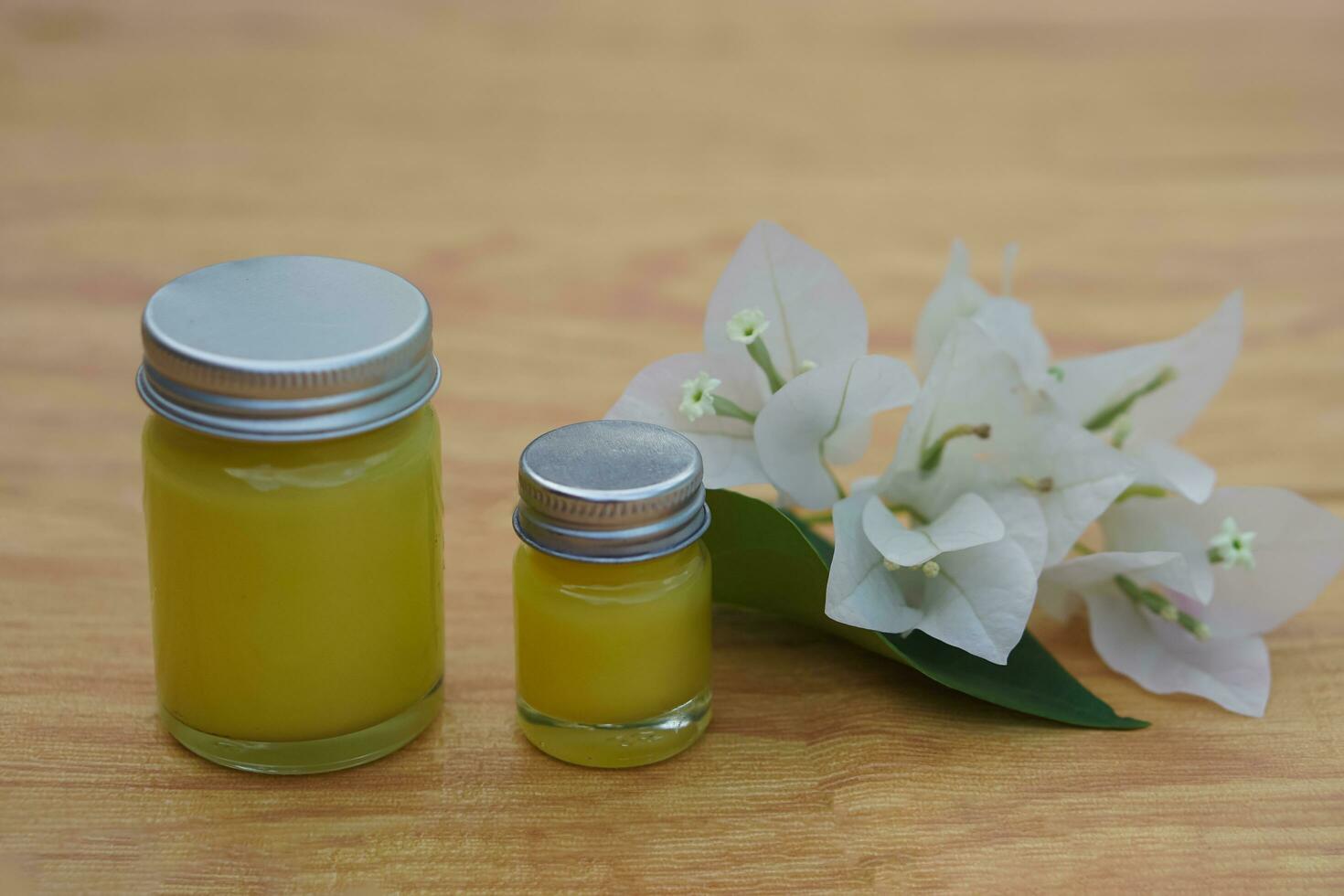 Bottles of homemade Thai herbal ointment. Concept, Thai local wisdom to use  fragrant medicinal herbs to make inhaler and massage balm. photo