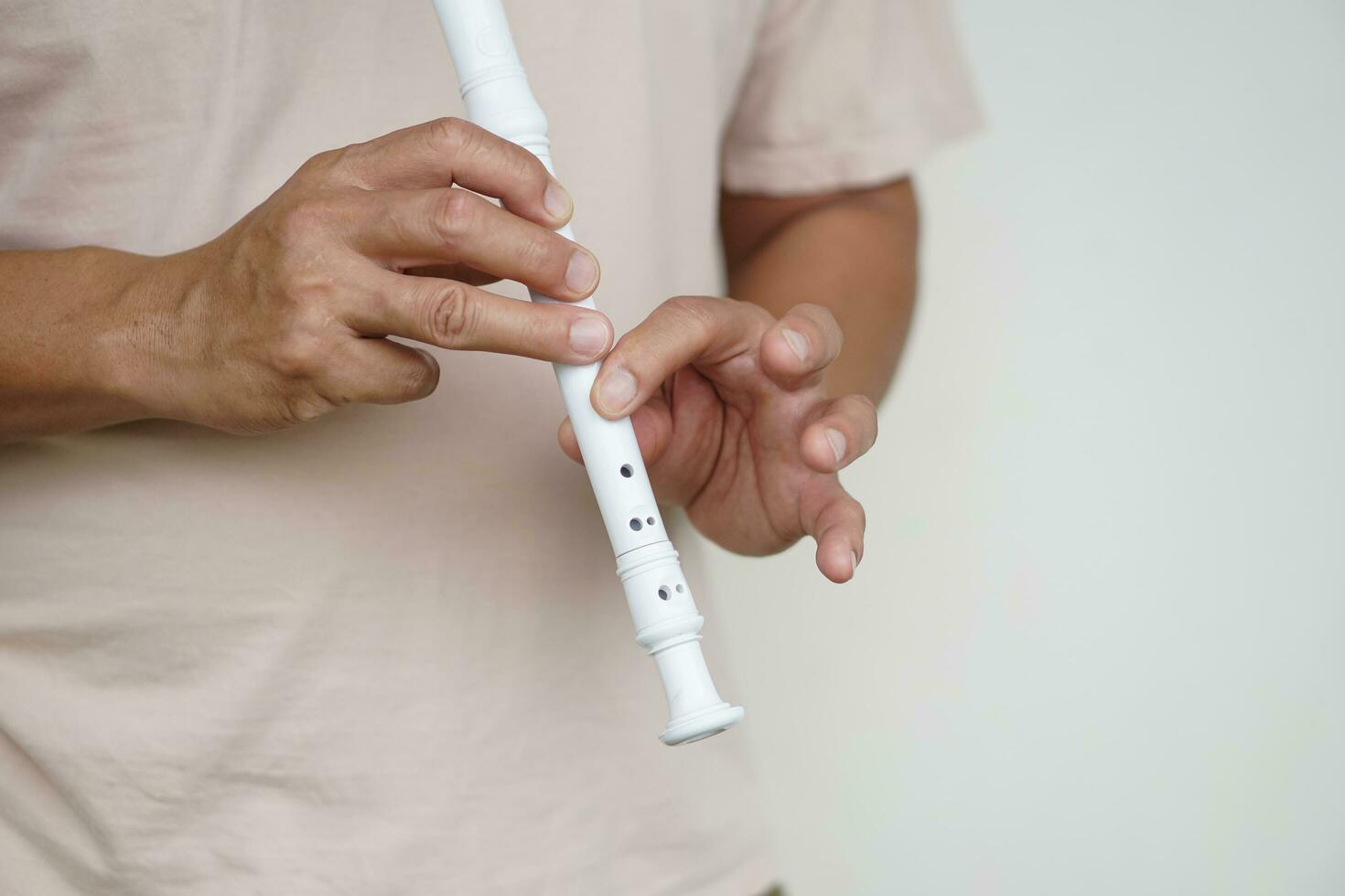 Hands of a musician playing the flute. Musical instrument. Concept, love music. Melody therapy, make concentration. Man practice to play music for being professional flutist photo