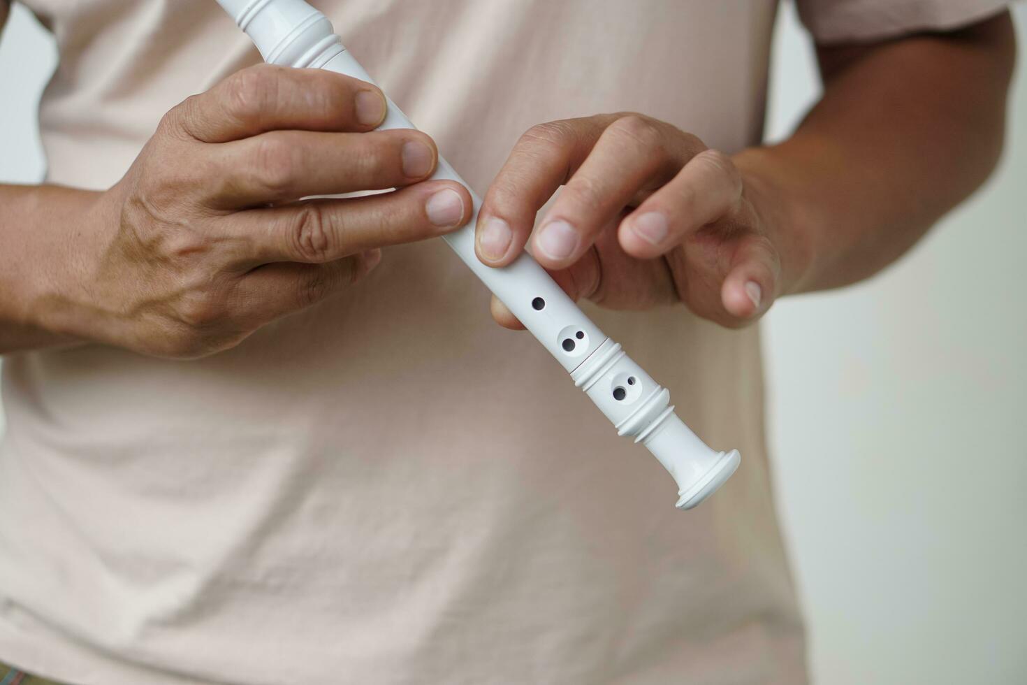 Hands of a musician playing the flute. Musical instrument. Concept, love music. Melody therapy, make concentration. Man practice to play music for being professional flutist photo