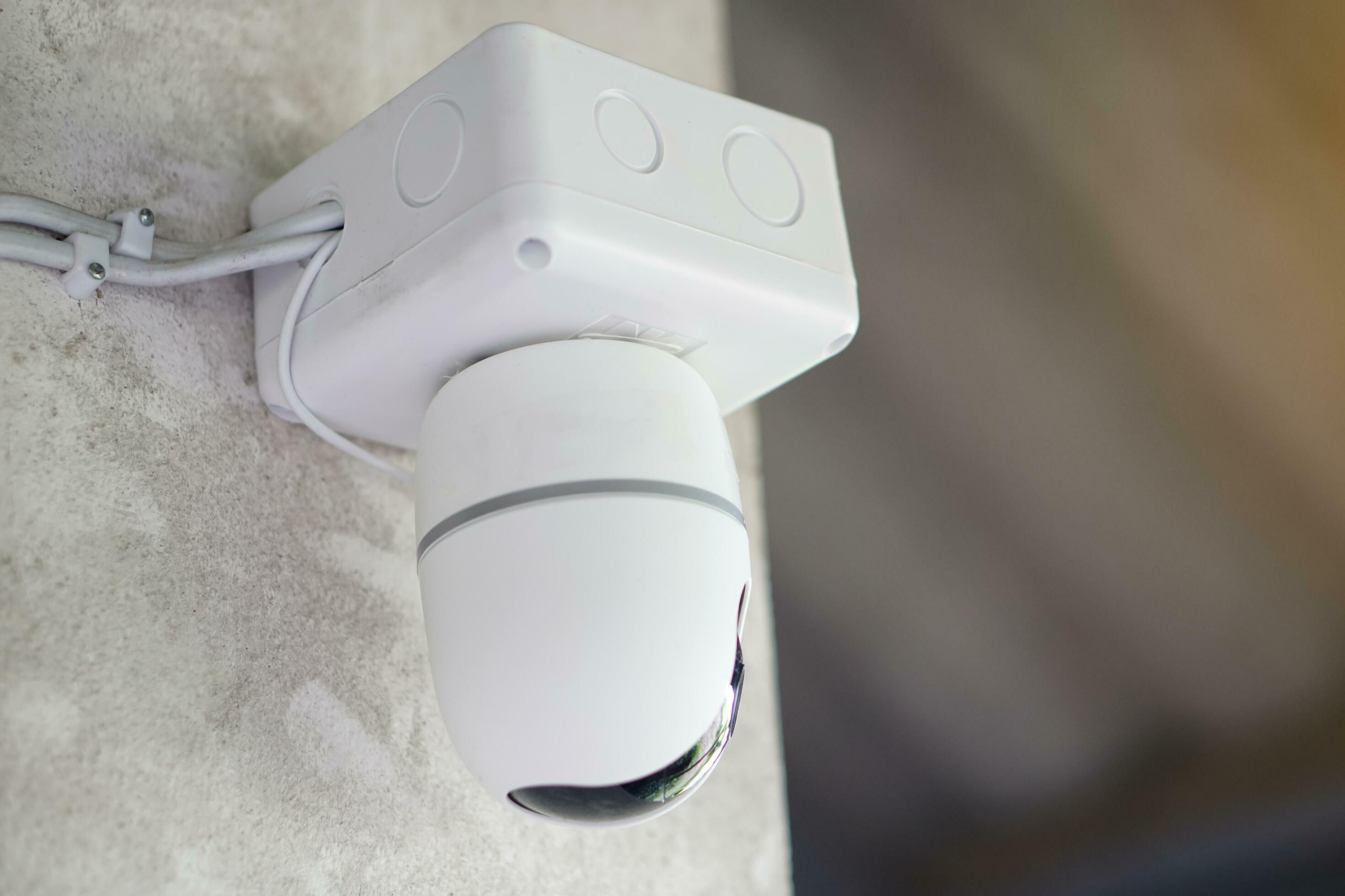 Mini CCTV security camera system installed on the wall. Concept