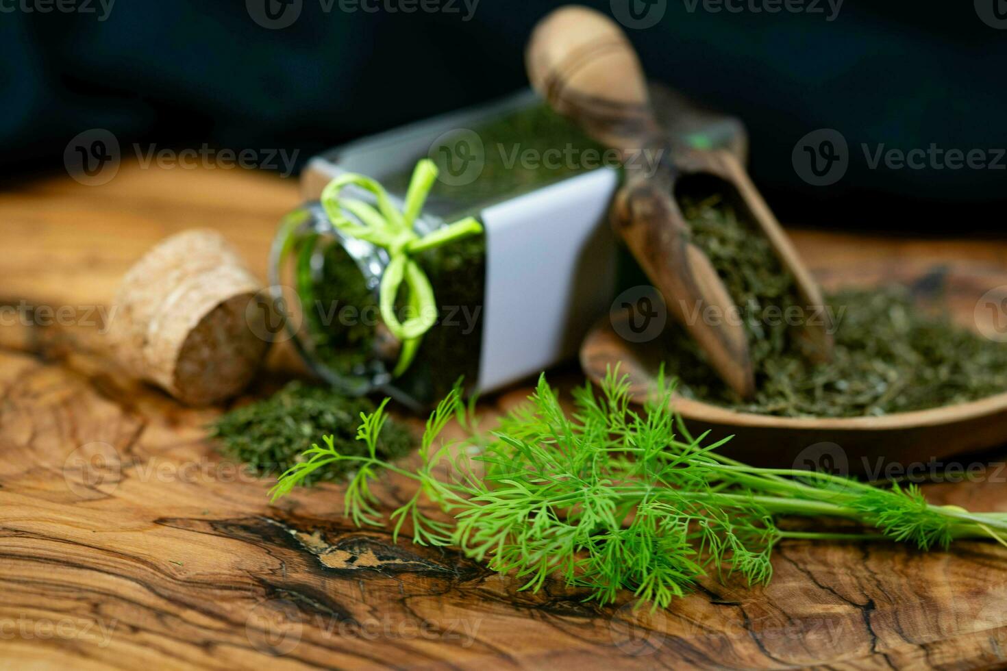 Dill Anethum graveolens on olive wood photo