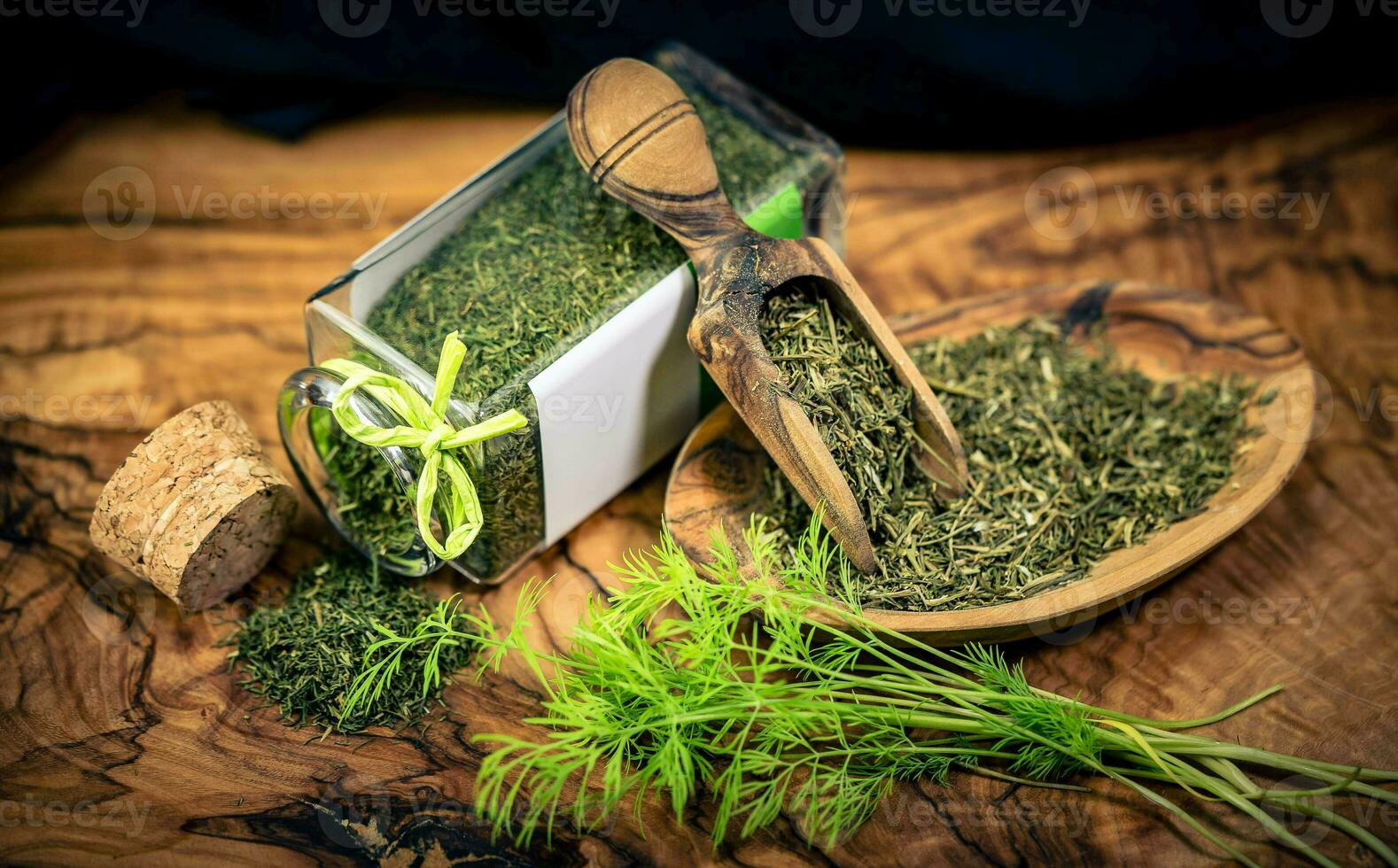 Dill Anethum graveolens on olive wood photo