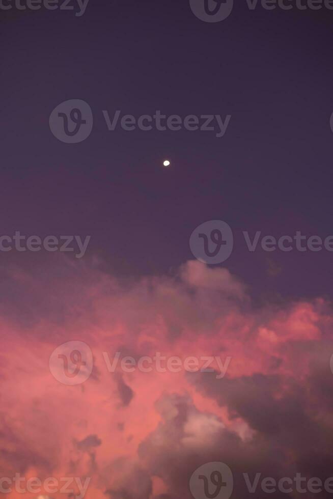 Night sky with clouds and the Moon. photo