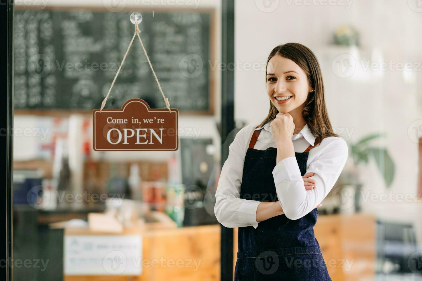 Startup successful small business owner sme woman stand with tablet  in cafe restaurant. woman barista cafe owner. photo