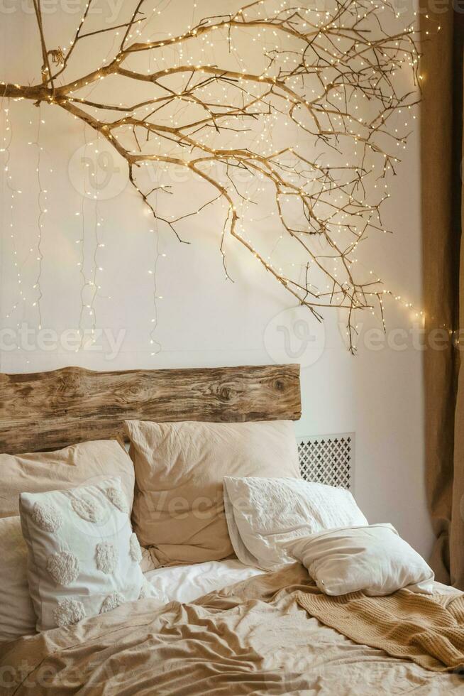 Cozy interior decorated for Christmas in Scandinavian style. Live fir trees decorated with natural ornaments made of dried oranges photo