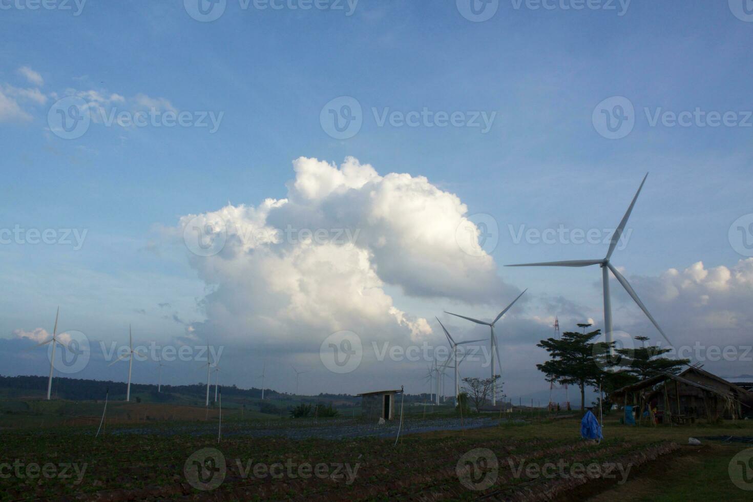 Wind turbines at sunset with a beautiful sky in the background. The concept of renewable energy. photo