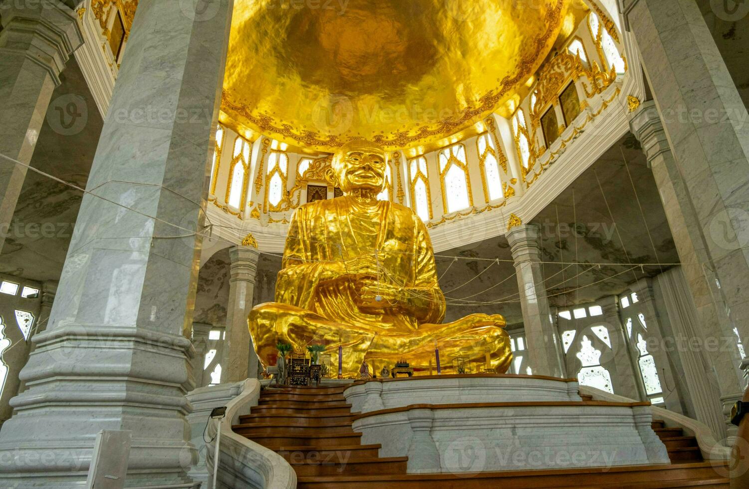 Wat Luang Pho To is a place of worship for Thai people located in the middle of rice fields. And there is a big Buddha inside when the sky is blue. photo