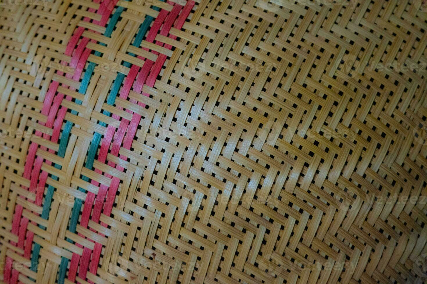 The patterns are strung together in a grid from bamboo that is woven together to form a pattern. Can be used as a strange background. photo