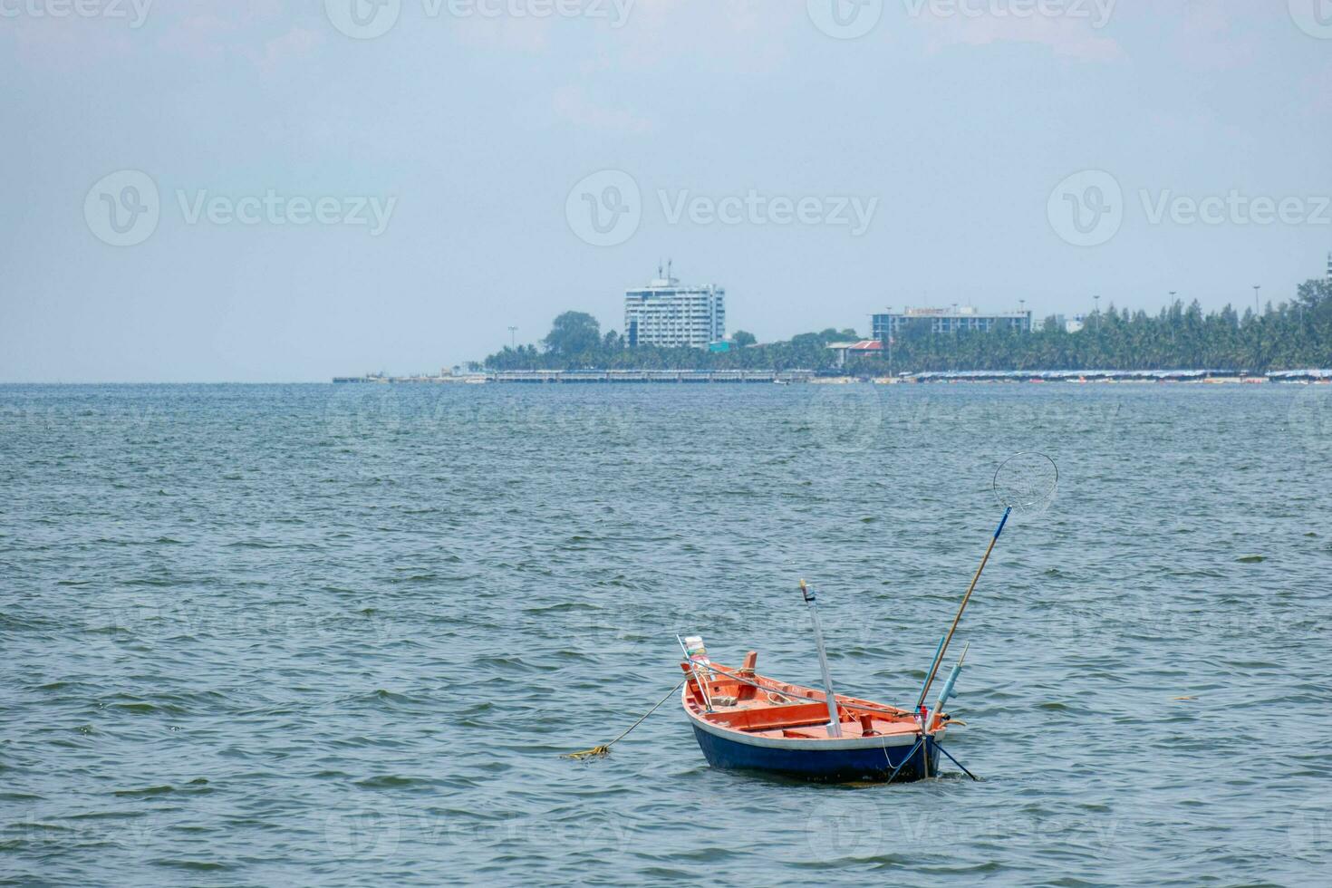 Fishing boats used to catch fish Located on sea water with slight waves. Used to find food for people who earn a living catching fish. For those who live next to the sea photo