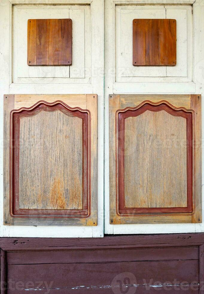The closed wooden window of the ticket booth. photo
