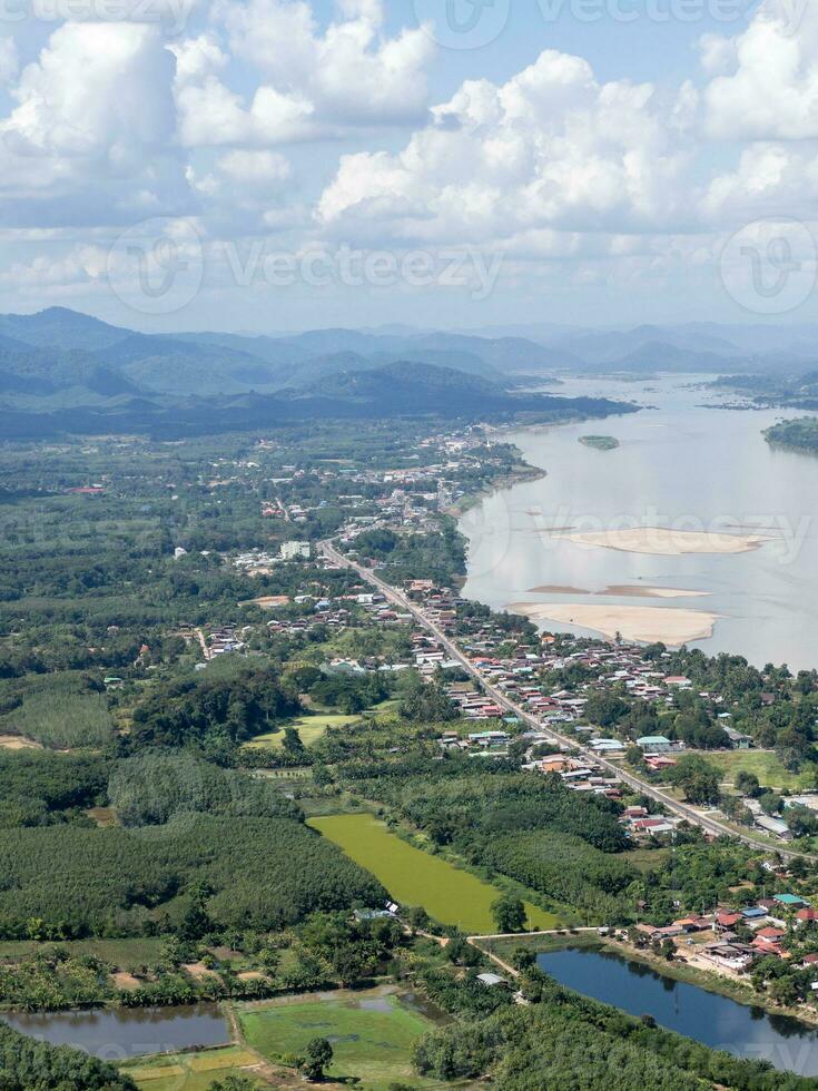 Above view of the border town in the valley along the large river. photo